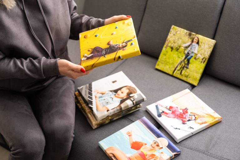 Photo canvas print. A woman holding a photography with gallery wrap